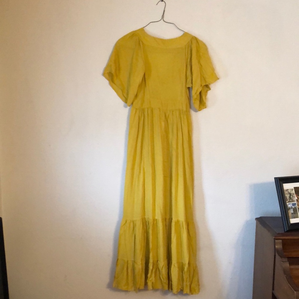 A yellow never been worn dress.